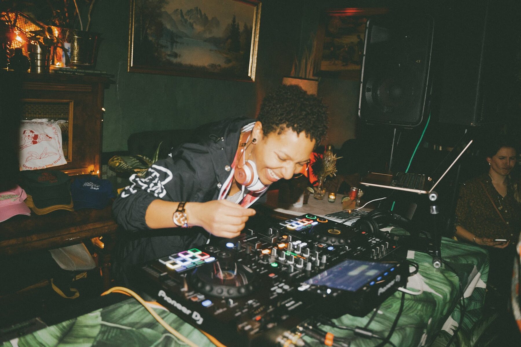 DJ Mahay smiling at a house party set